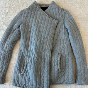 Grey quilted jacket with pockets